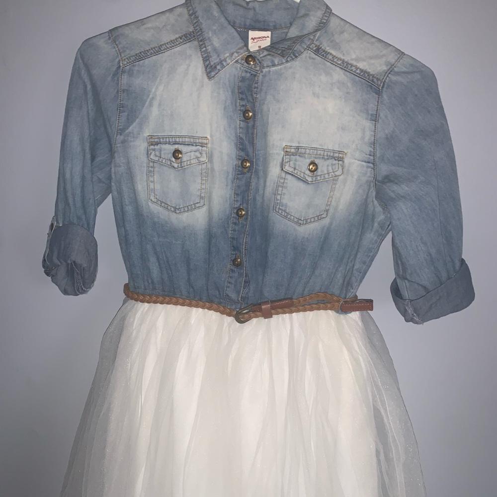 A jean dress with a white mesh skirt.